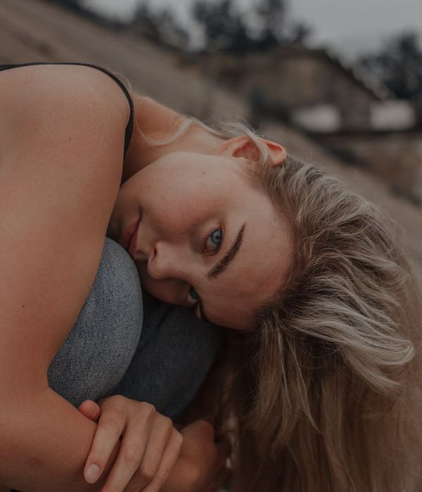 Beautiful woman with serene expression focusing her gaze peacefully.