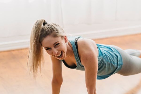Person doing gentle exercises in a bright airy room.